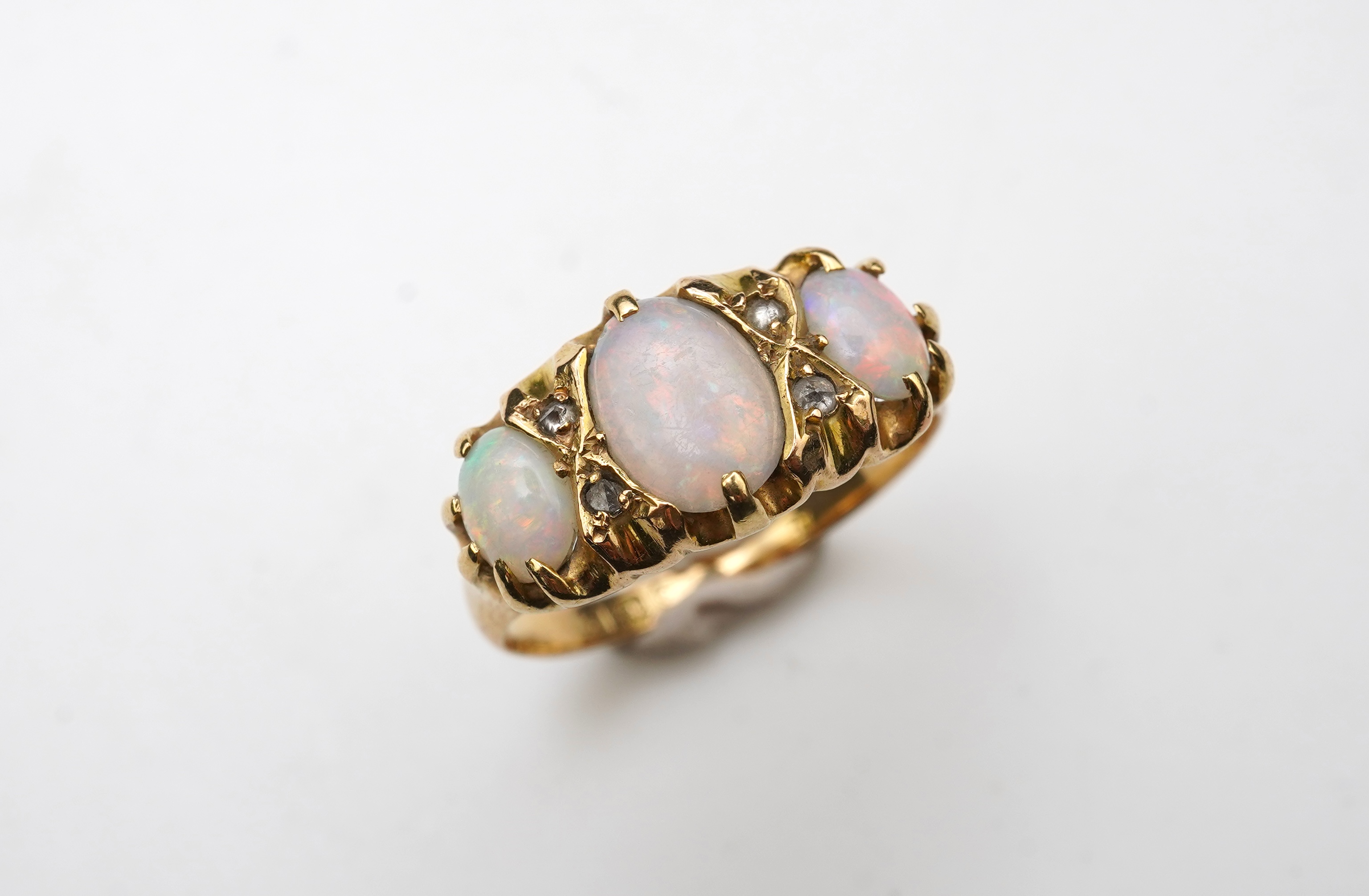 A Victorian 18ct gold and opal ring, circa 1898